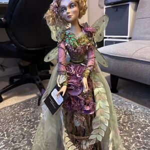Elegant Fairy Figurine with Purple and Green Accents